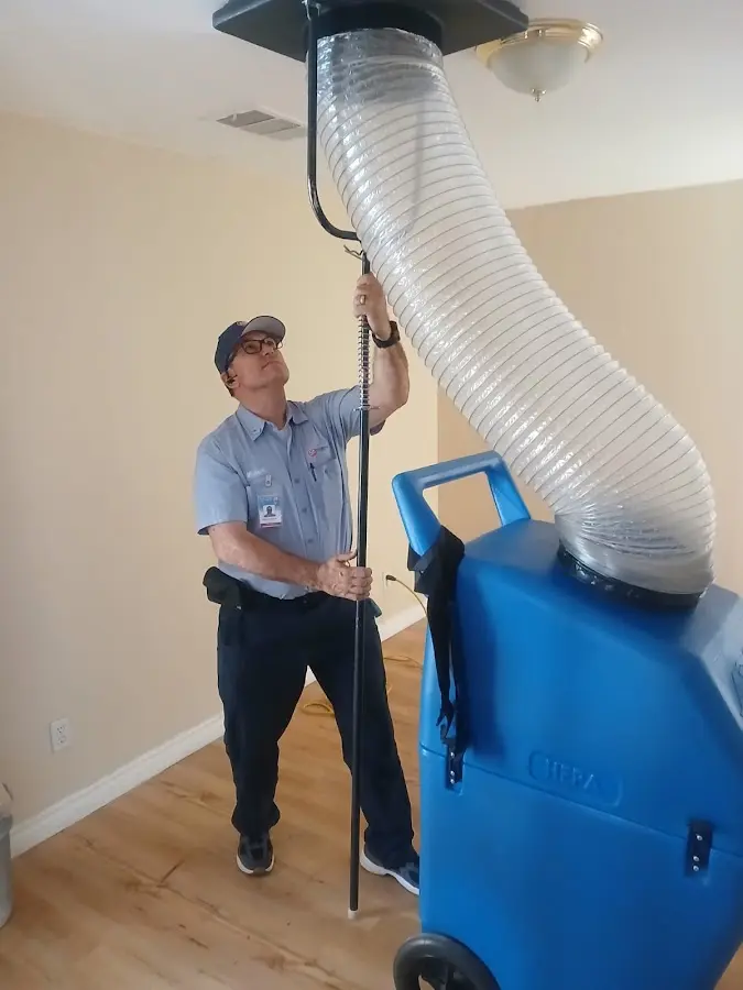Furnace Tune-Up technician using HEPA equipment in Zionsville